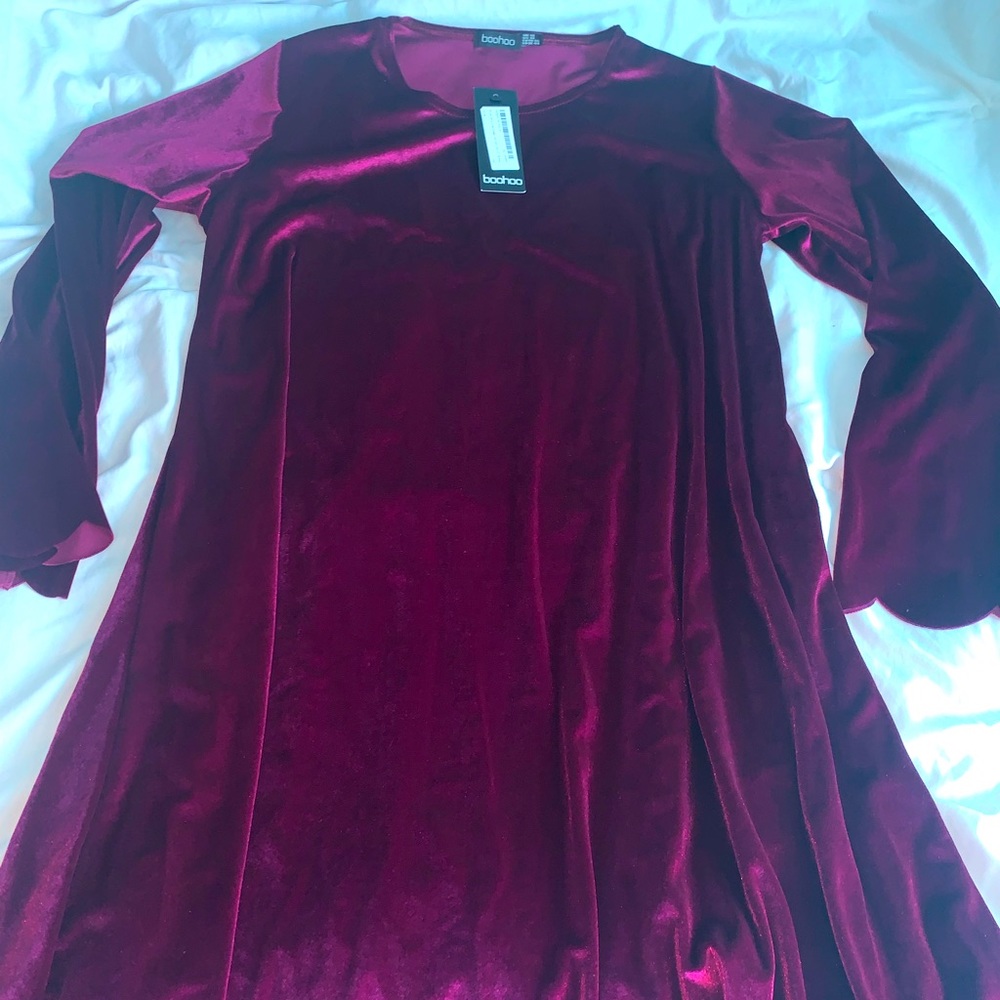 Beautiful velvet long sleeve dress with scalloped bottom and sleeves.